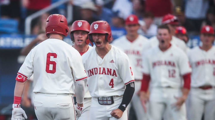 As Indiana's Peter Serruto crosses home after hitting a three-run homer in the seventh, teammate Hunter Jessee (4) yells as the Hoosiers defeated Kentucky 5-3 Saturday night in the 2023 NCAA Regional at Kentucky Proud Park in Lexington. June 3, 2023. As Indiana's Peter Serruto crosses home after hitting a three-run homer in the seventh, teammate Hunter Jessee (4) yells as the Hoosiers defeated Kentucky 5-3 Saturday night in the 2023 NCAA Regional at Kentucky Proud Park in Lexington. June 3, 2023.