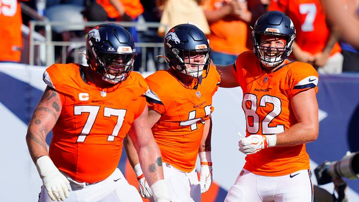Sep 20, 2026; Denver, Colorado, USA;  Denver Broncos tight end Nate Adkins (45) celebrates with tight end Adam Trautman (82) after scoring a touchdown during the fourth quarter against the Jacksonville Jaguars at Empower Field at Mile High.  Mandatory Credit: Ron Chenoy-Imagn Images