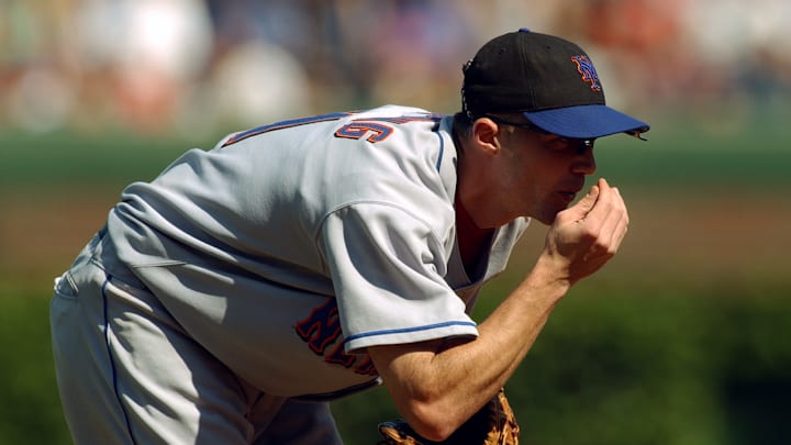 Joe McEwing blows on his hand