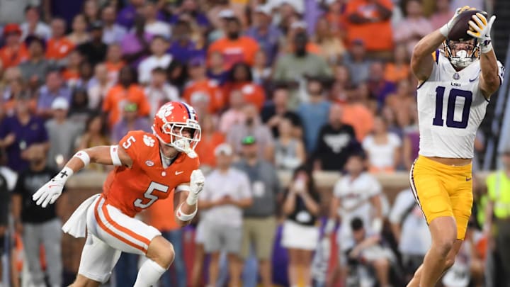 LSU Tigers tight end Bauer Sharp (10) catches a pass while being defended by Clemson Tigers defensive back Ronan Hanafin (5) Saturday, Aug. 30, 2025 during the NCAA football game at Memorial Stadium in Clemson, South Carolina. LSU Tigers tight end Bauer Sharp (10) catches a pass while being defended by Clemson Tigers defensive back Ronan Hanafin (5) Saturday, Aug. 30, 2025 during the NCAA football game at Memorial Stadium in Clemson, South Carolina.