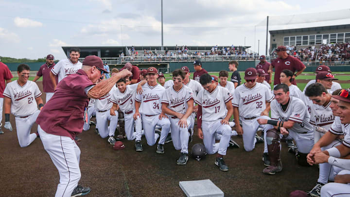 Calallen head baseball coach Steve Chapman celebrates with the team after defeating China Spring in six innings at game two of the Class 4A Division I UIL State Semifinal series in San Antonio.
