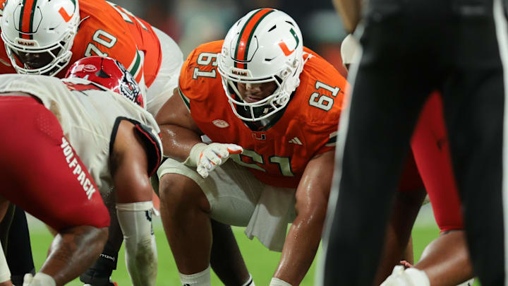 Nov 15, 2025; Miami Gardens, Florida, USA; Miami Hurricanes offensive lineman Francis Mauigoa (61) plays his position against NC State Wolfpack during the third quarter at Hard Rock Stadium. Mandatory Credit: Sam Navarro-Imagn Images Nov 15, 2025; Miami Gardens, Florida, USA; Miami Hurricanes offensive lineman Francis Mauigoa (61) plays his position against NC State Wolfpack during the third quarter at Hard Rock Stadium. Mandatory Credit: Sam Navarro-Imagn Images
