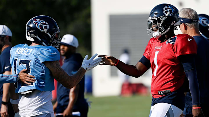 Tennessee Titans quarterback Cam Ward (1) and wide receiver Mason Kinsey (12) shake hands during an NFL football training camp practice at Ascension Saint Thomas Sports Park Saturday, Aug. 2, 2025, in Nashville, Tenn.