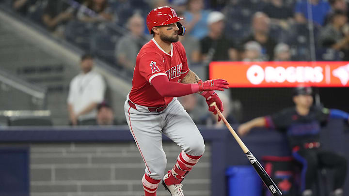 Aug 23, 2024; Toronto, Ontario, CAN; Los Angeles Angels center fielder Kevin Pillar (12) singles against the Toronto Blue Jays during the ninth inning at Rogers Centre. Mandatory Credit: John E. Sokolowski-Imagn Images