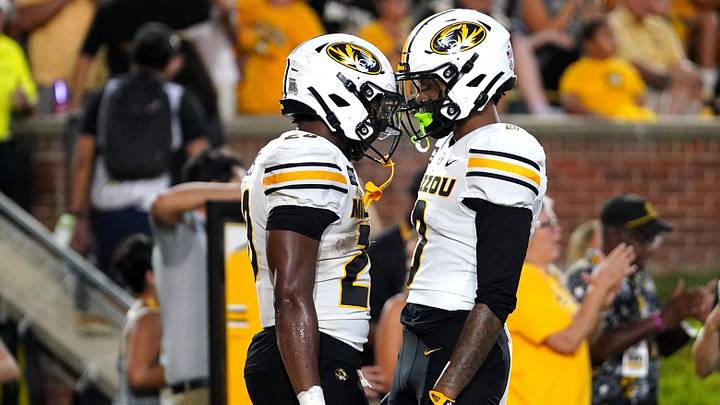 Sep 3, 2026; Columbia, Missouri, USA;  Missouri Tigers running back Jamal Roberts (20) celebrates with Missouri Tigers wide receiver Naeshaun Montgomery (0) after scoring a touchdown against the Arkansas-Pine Bluff Golden Lions during the first half at Faurot Field at Memorial Stadium.  Mandatory Credit: Denny Medley-Imagn Images