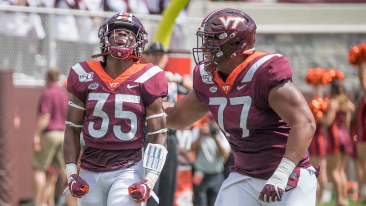 Sep 7, 2019; Blacksburg, VA, USA; Virginia Tech Hokies running back Keshawn King 935) celebrates his first touch down with Christian Darrisaw (77) in the first period against the Old Dominion Monarchs at Lane Stadium. Mandatory Credit: Lee Luther Jr.-USA TODAY Sports