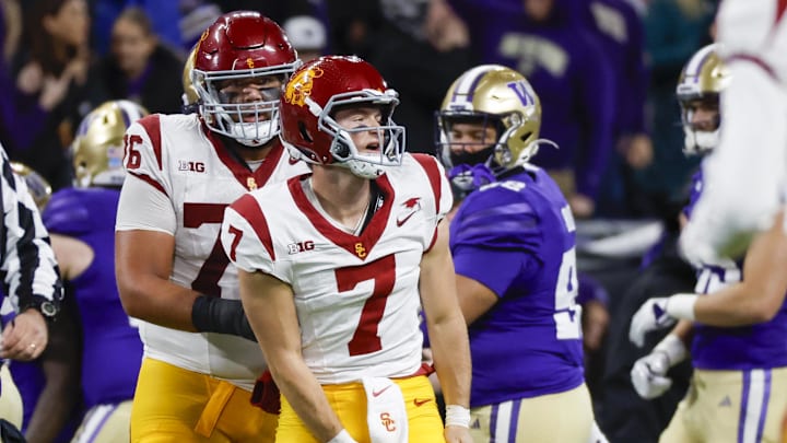 Nov 2, 2024; Seattle, Washington, USA; USC Trojans quarterback Miller Moss (7) reacts following a turnover on downs against the Washington Huskies during the fourth quarter at Alaska Airlines Field at Husky Stadium. Mandatory Credit: Joe Nicholson-Imagn Images Nov 2, 2024; Seattle, Washington, USA; USC Trojans quarterback Miller Moss (7) reacts following a turnover on downs against the Washington Huskies during the fourth quarter at Alaska Airlines Field at Husky Stadium. Mandatory Credit: Joe Nicholson-Imagn Images