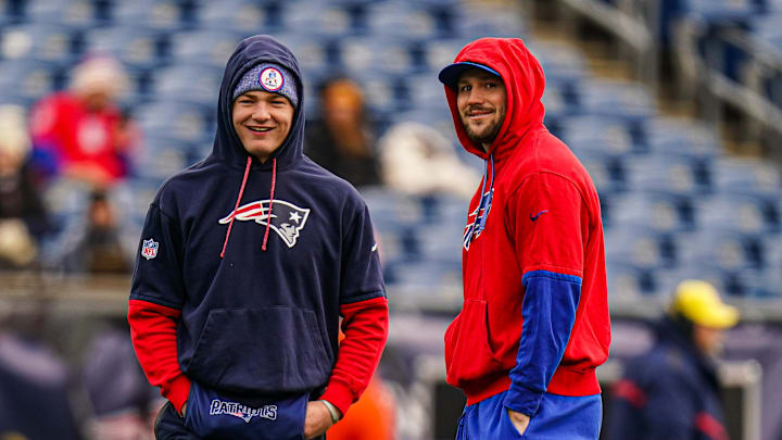 Jan 5, 2025; Foxborough, Massachusetts, USA; Buffalo Bills quarterback Josh Allen (17) and New England Patriots quarterback Drake Maye (10) talk on the field before the start of the game at Gillette Stadium. Mandatory Credit: David Butler II-Imagn Images