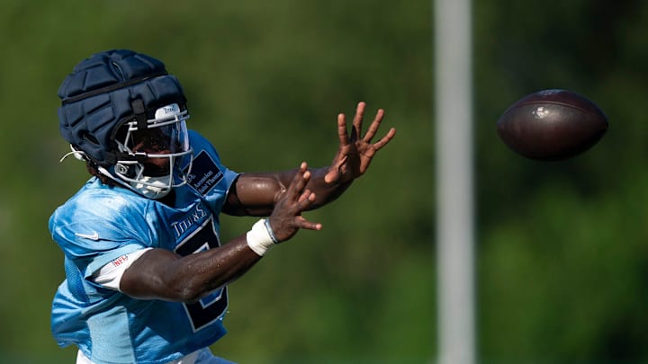 Tennessee Titans running back Tyjae Spears makes a catch during training camp.