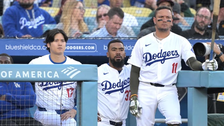 May 18, 2024; Los Angeles, California, USA; Los Angeles Dodgers designated hitter Shohei Ohtani (17), right fielder Teoscar Hernandez (37) and shortstop Miguel Rojas (11) look on from the dugout in the second inning against the Cincinnati Reds at Dodger Stadium. Mandatory Credit: Jayne Kamin-Oncea-USA TODAY Sports May 18, 2024; Los Angeles, California, USA; Los Angeles Dodgers designated hitter Shohei Ohtani (17), right fielder Teoscar Hernandez (37) and shortstop Miguel Rojas (11) look on from the dugout in the second inning against the Cincinnati Reds at Dodger Stadium. Mandatory Credit: Jayne Kamin-Oncea-USA TODAY Sports