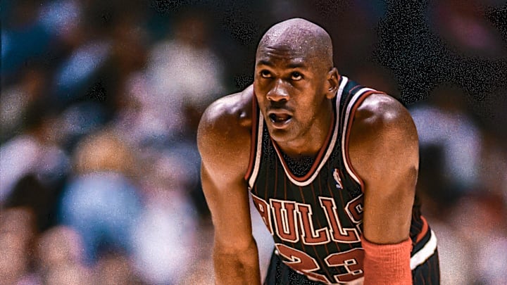 Chicago Bulls guard Michael Jordan looks on during a game. Chicago Bulls guard Michael Jordan looks on during a game.