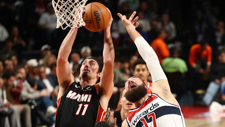 [US, Mexico & Canada customers only] Nov 2, 2024; Mexico City, MEXICO;  Miami Heat player Jaime Jaquez Jr. battles for a rebound with Washington Wizards player Jonas Valanciunas during a NBA basketball game at Arena CDMX. Mandatory Credit: Henry Romero/Reuters via Imagn Images