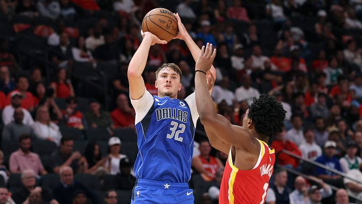 Oct 21, 2026; Houston, Texas, USA; Dallas Mavericks forward Cooper Flagg (32) shoots the ball over Houston Rockets guard/forward Amen Thompson (1) during the fourth quarter at Toyota Center. Oct 21, 2026; Houston, Texas, USA; Dallas Mavericks forward Cooper Flagg (32) shoots the ball over Houston Rockets guard/forward Amen Thompson (1) during the fourth quarter at Toyota Center.