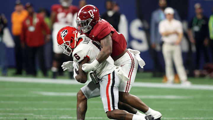 Dec 2, 2023; Atlanta, GA, USA; Alabama Crimson Tide linebacker Trezmen Marshall (17) tackles Georgia Bulldogs wide receiver Dominic Lovett (6) in the third quarter at Mercedes-Benz Stadium. Mandatory Credit: Brett Davis-Imagn Images Dec 2, 2023; Atlanta, GA, USA; Alabama Crimson Tide linebacker Trezmen Marshall (17) tackles Georgia Bulldogs wide receiver Dominic Lovett (6) in the third quarter at Mercedes-Benz Stadium. Mandatory Credit: Brett Davis-Imagn Images