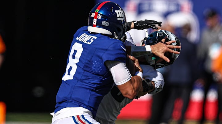 Oct 20, 2024; East Rutherford, New Jersey, USA; New York Giants quarterback Daniel Jones (8) fights off would-be tackler Philadelphia Eagles linebacker Josh Sweat (19) during the first half at MetLife Stadium. Oct 20, 2024; East Rutherford, New Jersey, USA; New York Giants quarterback Daniel Jones (8) fights off would-be tackler Philadelphia Eagles linebacker Josh Sweat (19) during the first half at MetLife Stadium.