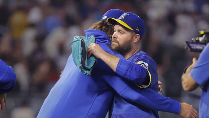 May 9, 2025; Minneapolis, Minnesota, USA; Minnesota Twins starting pitcher Chris Paddack (20) and relief pitcher Danny Coulombe (54) celebrate the win over the San Francisco Giants at Target Field. Mandatory Credit: Bruce Kluckhohn-Imagn Images