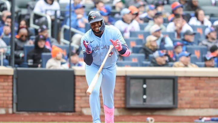 Apr 6, 2025; New York City, New York, USA;  Toronto Blue Jays first baseman Vladimir Guerrero Jr. (27) flips his bat after flying out in the third inning against the New York Mets at Citi Field. Mandatory Credit: Wendell Cruz-Imagn Images
