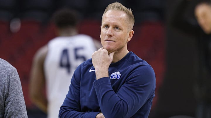 Mar 26, 2025; Newark, NJ, USA; Brigham Young Cougars head coach Kevin Young warms up during a practice session in preparation for an East Regional semifinal game against the Alabama Crimson Tide at Prudential Center. Mandatory Credit: Vincent Carchietta-Imagn Images