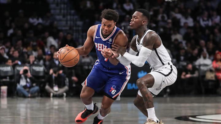 Mar 5, 2024; Brooklyn, New York, USA;  Philadelphia 76ers guard Kyle Lowry (7) looks to drive past Brooklyn Nets guard Dennis Schroder (17) in the first quarter at Barclays Center. Mandatory Credit: Wendell Cruz-Imagn Images