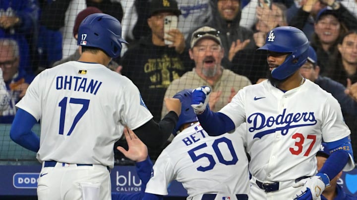 Apr 1, 2025; Los Angeles, California, USA; Los Angeles Dodgers designated hitter Shohei Ohtani (17) shortstop Mookie Betts (50) is congratulated by left fielder Teoscar Hernandez (37) after hitting a two run home run by shortstop Mookie Betts (50) in the sixth inning against the Atlanta Braves at Dodger Stadium. Mandatory Credit: Jayne Kamin-Oncea-Imagn Images Apr 1, 2025; Los Angeles, California, USA; Los Angeles Dodgers designated hitter Shohei Ohtani (17) shortstop Mookie Betts (50) is congratulated by left fielder Teoscar Hernandez (37) after hitting a two run home run by shortstop Mookie Betts (50) in the sixth inning against the Atlanta Braves at Dodger Stadium. Mandatory Credit: Jayne Kamin-Oncea-Imagn Images