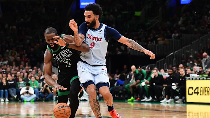 Apr 6, 2025; Boston, Massachusetts, USA; Boston Celtics guard Jaylen Brown (7) runs into Washington Wizards forward Justin Champagnie (9) during the second half at TD Garden. Mandatory Credit: Bob DeChiara-Imagn Images