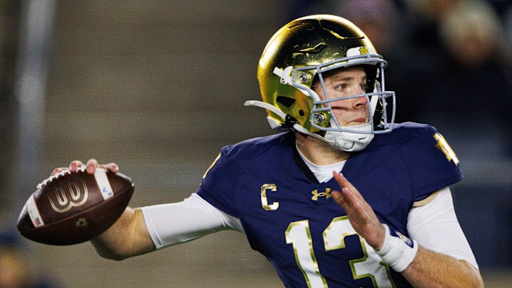 Notre Dame quarterback Riley Leonard (13) throws the ball during a NCAA college football game against Virginia at Notre Dame Stadium on Saturday, Nov. 16, 2024, in South Bend.