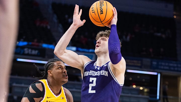 Mar 12, 2025; Indianapolis, IN, USA;  Northwestern Wildcats forward Nick Martinelli (2) shoots the ball while Minnesota Golden Gophers forward Frank Mitchell (00) defends in the first half at Gainbridge Fieldhouse. Mandatory Credit: Trevor Ruszkowski-Imagn Images