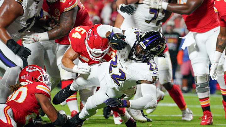 Sep 5, 2024; Kansas City, Missouri, USA; Baltimore Ravens running back Derrick Henry (22) scores a touchdown as Kansas City Chiefs linebacker Leo Chenal (54) attempts the tackle during the first half at GEHA Field at Arrowhead Stadium. Mandatory Credit: Denny Medley-Imagn Images