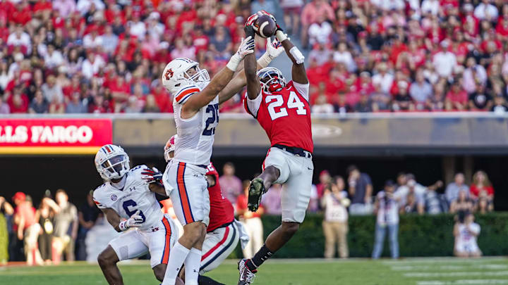 Oct 8, 2022; Athens, Georgia, USA; Georgia Bulldogs defensive back Malaki Starks (24) tries to intercept a pass in front of Auburn Tigers tight end John Samuel Shenker (25) during the second half at Sanford Stadium. Mandatory Credit: Dale Zanine-Imagn Images Oct 8, 2022; Athens, Georgia, USA; Georgia Bulldogs defensive back Malaki Starks (24) tries to intercept a pass in front of Auburn Tigers tight end John Samuel Shenker (25) during the second half at Sanford Stadium. Mandatory Credit: Dale Zanine-Imagn Images