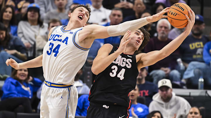 UCLA Bruins forward Tyler Bilodeau (34) and Gonzaga Bulldogs forward Braden Huff (34) battle for a rebound.