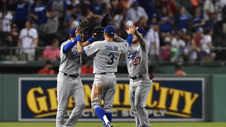 Jul 13, 2019; Boston, MA, USA; Los Angeles Dodgers center fielder A.J. Pollock (11), left fielder Chris Taylor (3) and right fielder Alex Verdugo (27) celebrate after defeating the Boston Red Sox at Fenway Park. Mandatory Credit: Bob DeChiara-Imagn Images
