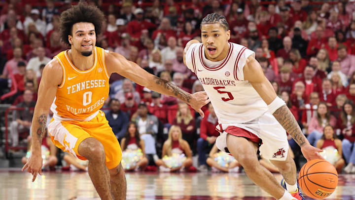 Jan 3, 2026; Fayetteville, Arkansas, USA; Arkansas Razorbacks guard Darius Acuff Jr (5) drives against Tennessee Volunteers guard Jacobi Gillespie (0) during the second half at Bud Walton Arena. Mandatory Credit: Nelson Chenault-Imagn Images Jan 3, 2026; Fayetteville, Arkansas, USA; Arkansas Razorbacks guard Darius Acuff Jr (5) drives against Tennessee Volunteers guard Jacobi Gillespie (0) during the second half at Bud Walton Arena. Mandatory Credit: Nelson Chenault-Imagn Images