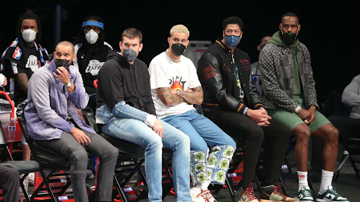 Apr 10, 2021; Brooklyn, New York, USA; Los Angeles Lakers small forward Jared Dudley (10) and center Marc Gasol (14) and small forward Kyle Kuzma (0) and power forward Anthony Davis (3) and small forward LeBron James (23) watch from the bench during the second quarter against the Brooklyn Nets at Barclays Center. Mandatory Credit: Brad Penner-Imagn Images