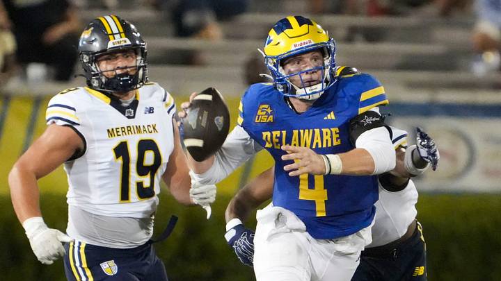 Delaware quarterback Nick Minicucci throws while under pressure in the Blue Hens’ 42-7 season opening win against Merrimack at Delaware Stadium, Sept. 3, 2026. Delaware quarterback Nick Minicucci throws while under pressure in the Blue Hens’ 42-7 season opening win against Merrimack at Delaware Stadium, Sept. 3, 2026.