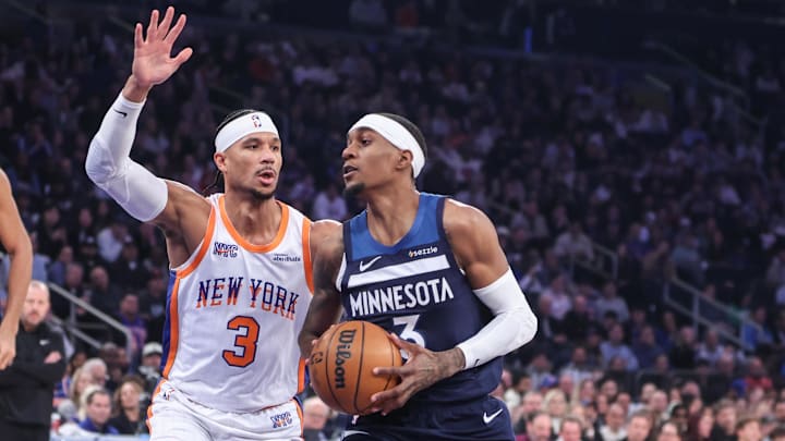Minnesota Timberwolves forward Jaden McDaniels looks to drive past New York Knicks guard Josh Hart in the first quarter at Madison Square Garden in New York on Jan. 17, 2025.