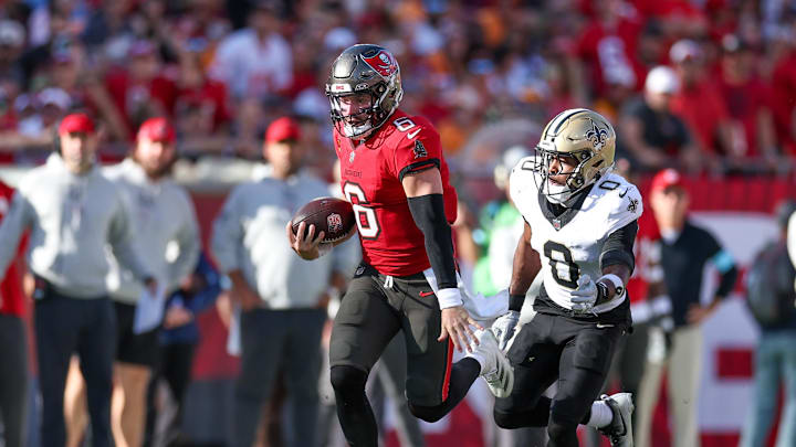 Jan 5, 2025; Tampa, Florida, USA; Tampa Bay Buccaneers quarterback Baker Mayfield (6) runs with the ball against the New Orleans Saints in the fourth quarter at Raymond James Stadium. Mandatory Credit: Nathan Ray Seebeck-Imagn Images Jan 5, 2025; Tampa, Florida, USA; Tampa Bay Buccaneers quarterback Baker Mayfield (6) runs with the ball against the New Orleans Saints in the fourth quarter at Raymond James Stadium. Mandatory Credit: Nathan Ray Seebeck-Imagn Images
