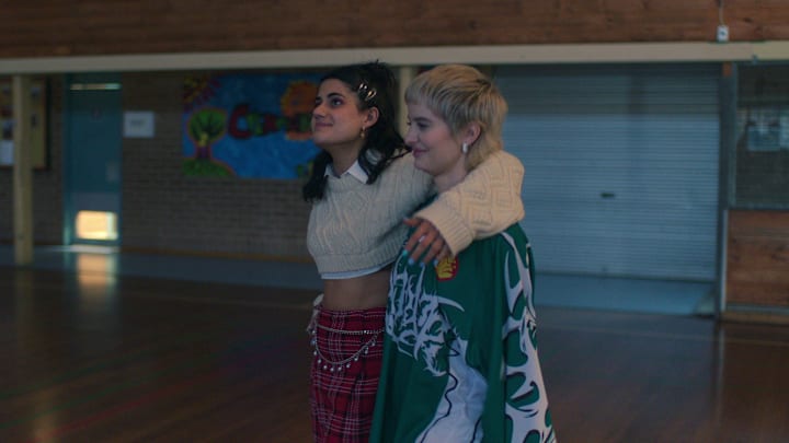 Heartbreak High S2. (L to R) Ayesha Madon as Amerie, Asher Yasbincek as Harper in Heartbreak High S2. Cr. Courtesy of Netflix © 2024