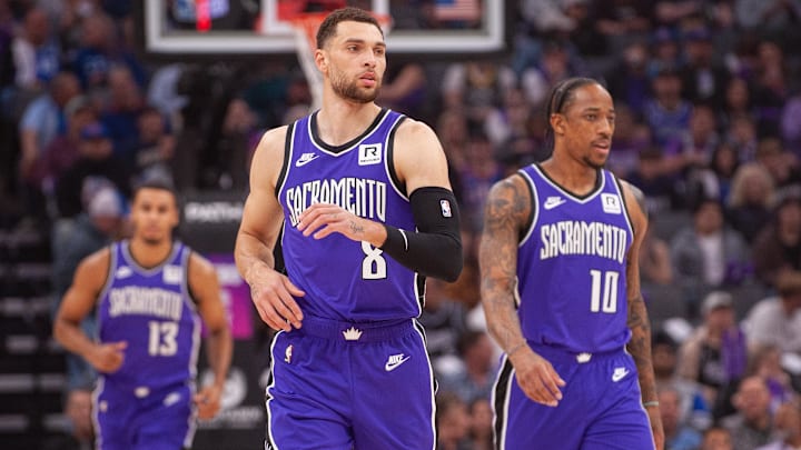 Feb 24, 2025; Sacramento, California, USA; Sacramento Kings guard Zach LaVine (8) and forward DeMar DeRozan (10) and forward Keegan Murray (13) walk up the court during the first quarter against the Charlotte Hornets at Golden 1 Center. Mandatory Credit: Ed Szczepanski-Imagn Images