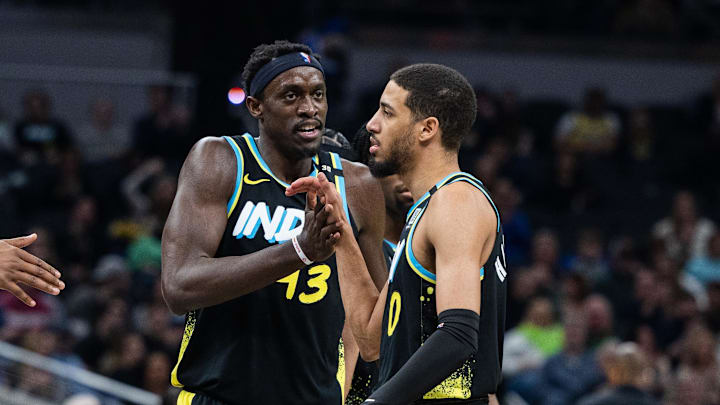 Mar 16, 2024; Indianapolis, Indiana, USA;  Indiana Pacers forward Pascal Siakam (43) celebrates with guard Tyrese Haliburton (0) in the first half against the Brooklyn Nets at Gainbridge Fieldhouse. Mandatory Credit: Trevor Ruszkowski-Imagn Images