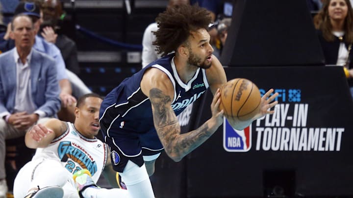 Dallas Mavericks center Dereck Lively II passes after a stealing the ball from Memphis Grizzlies guard Desmond Bane.