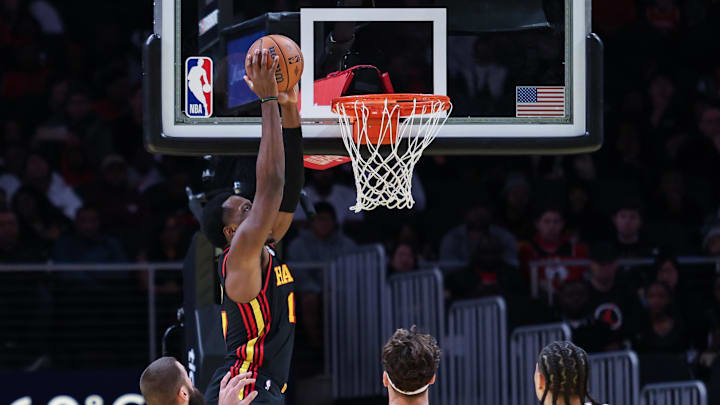 Nov 15, 2024; Atlanta, Georgia, USA; Atlanta Hawks forward Onyeka Okongwu (17) dunks against Washington Wizards center Jonas Valanciunas (17), forward Corey Kispert (24), and forward Kyshawn George (18) during the first quarter at State Farm Arena. Mandatory Credit: Jordan Godfree-Imagn Images Nov 15, 2024; Atlanta, Georgia, USA; Atlanta Hawks forward Onyeka Okongwu (17) dunks against Washington Wizards center Jonas Valanciunas (17), forward Corey Kispert (24), and forward Kyshawn George (18) during the first quarter at State Farm Arena. Mandatory Credit: Jordan Godfree-Imagn Images