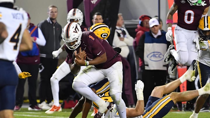 Oct 24, 2025; Blacksburg, Va.; Virginia Tech quarterback Kyron Drones (1) runs the ball for a touchdown against California.