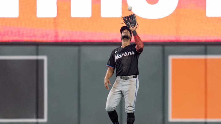 Sep 26, 2024; Minneapolis, Minnesota, USA; Miami Marlins outfielder Derek Hill (58) catches a ball hit by Minnesota Twins outfielder Byron Buxton (25) to end the fifth inning at Target Field. Sep 26, 2024; Minneapolis, Minnesota, USA; Miami Marlins outfielder Derek Hill (58) catches a ball hit by Minnesota Twins outfielder Byron Buxton (25) to end the fifth inning at Target Field.
