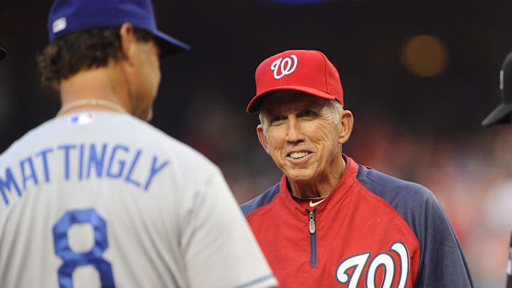 Jul 19, 2013; Washington, DC, USA; Washington Nationals manager Davey Johnson talks with Los Angeles Dodgers Manager Don Mattingly before the game at Nationals Park.  Mandatory Credit: Brad Mills-Imagn Images