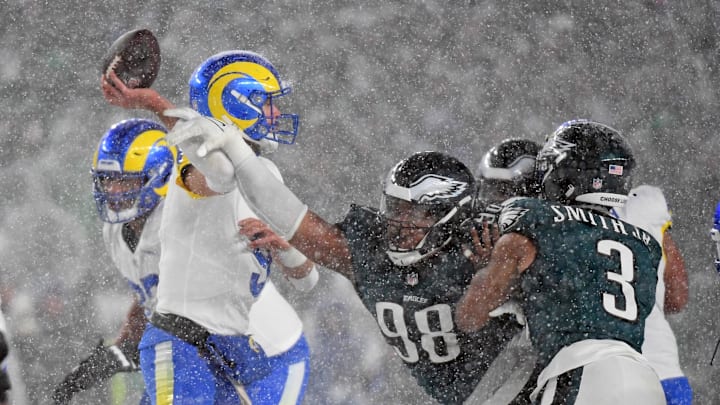 Jan 19, 2025; Philadelphia, Pennsylvania, USA;Los Angeles Rams quarterback Matthew Stafford (9) is pressured by Philadelphia Eagles defensive tackle Jalen Carter (98) during the fourth quarter in a 2025 NFC divisional round game at Lincoln Financial Field. Mandatory Credit: Eric Hartline-Imagn Images