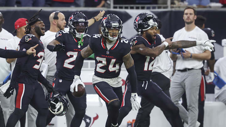 Dec 15, 2024; Houston, Texas, USA; Houston Texans cornerback Derek Stingley Jr. (24) reacts after an interception during the game against the Miami Dolphins at NRG Stadium. Mandatory Credit: Troy Taormina-Imagn Images