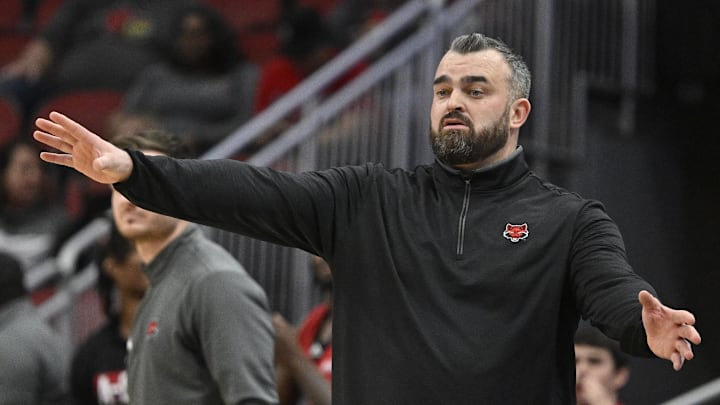 Arkansas State Red Wolves head coach Bryan Hodgson calls out instructions during the second half against the Louisville Cardinals at KFC Yum! Center. Arkansas State defeated Louisville 75-63. 