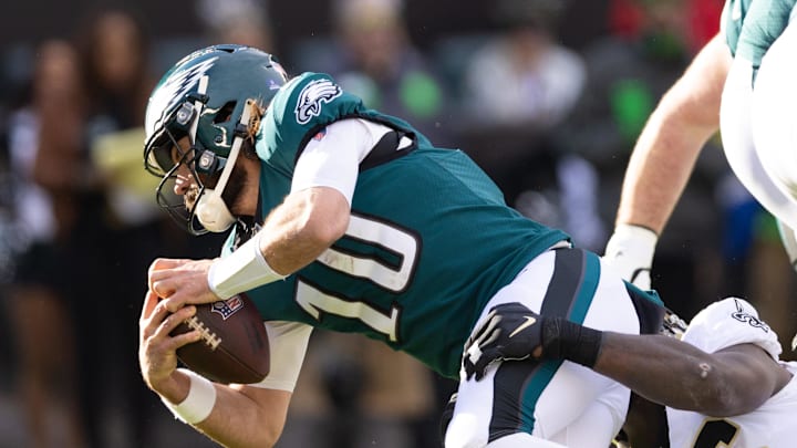 Jan 1, 2023; Philadelphia, Pennsylvania, USA; Philadelphia Eagles quarterback Gardner Minshew (10) is sacked by New Orleans Saints defensive end Carl Granderson (96) during the second quarter at Lincoln Financial Field. Mandatory Credit: Bill Streicher-Imagn Images
