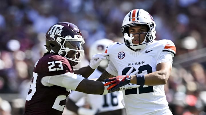Sep 27, 2025; College Station, Texas, USA; Texas A&M Aggies running back Jamarion Morrow (23) runs a route as Auburn Tigers cornerback Donovan Starr (22) defends in coverage during the first half at Kyle Field. Mandatory Credit: Maria Lysaker-Imagn Images 