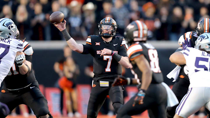 Oklahoma State's Alan Bowman (7) throws the ball in the first half of the college football game